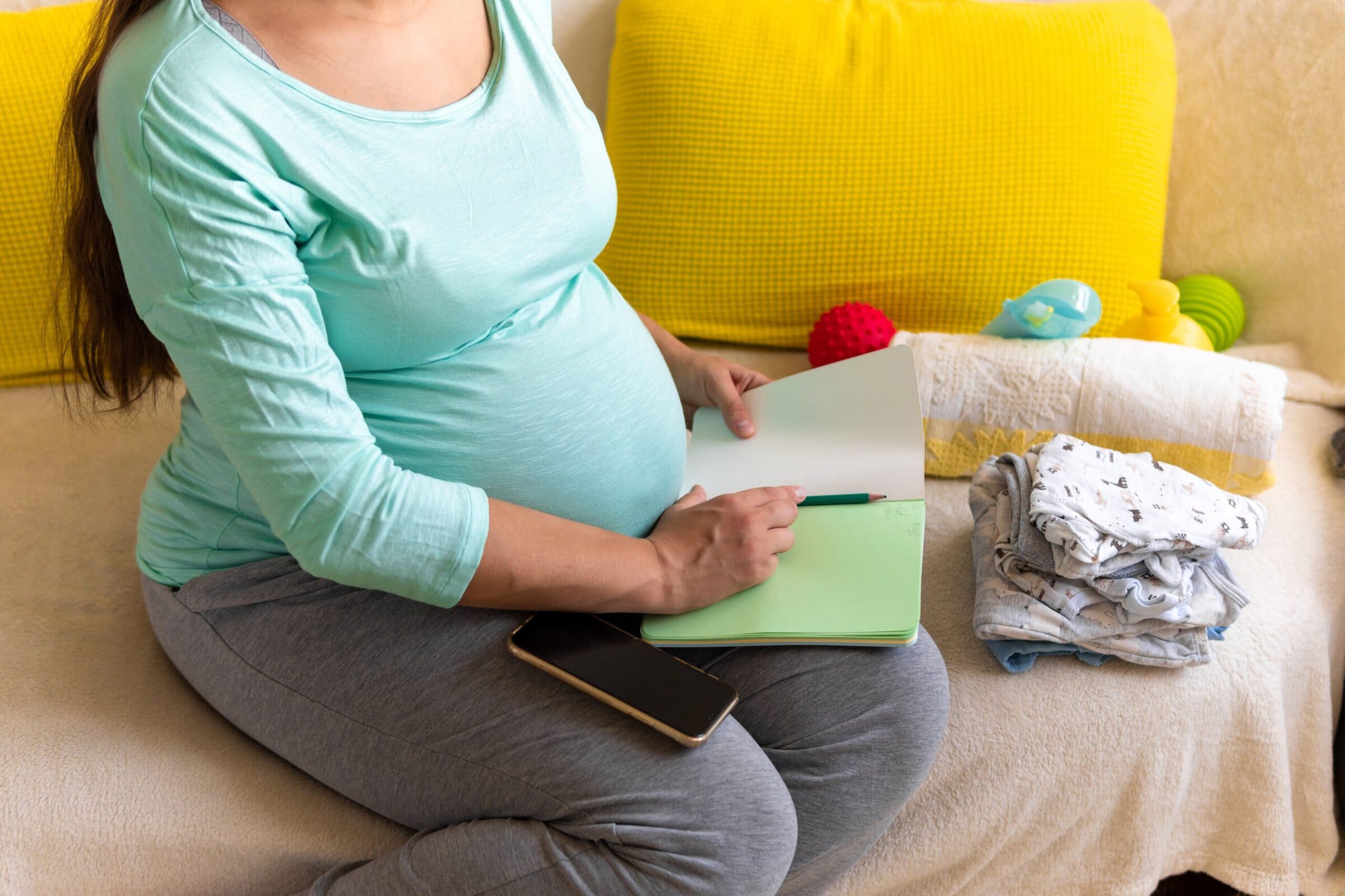 Cute,Pregnant,Woman,Writing,Packing,List,For,Maternity,Hospital,With