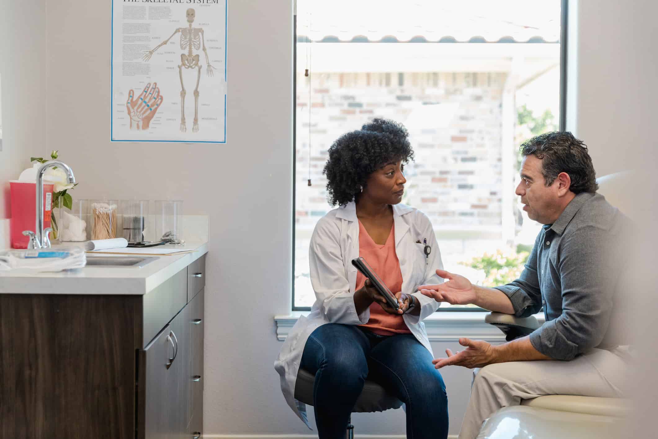 The medical billing coordinator meets with the patient to discuss payment options for his upcoming procedure.
